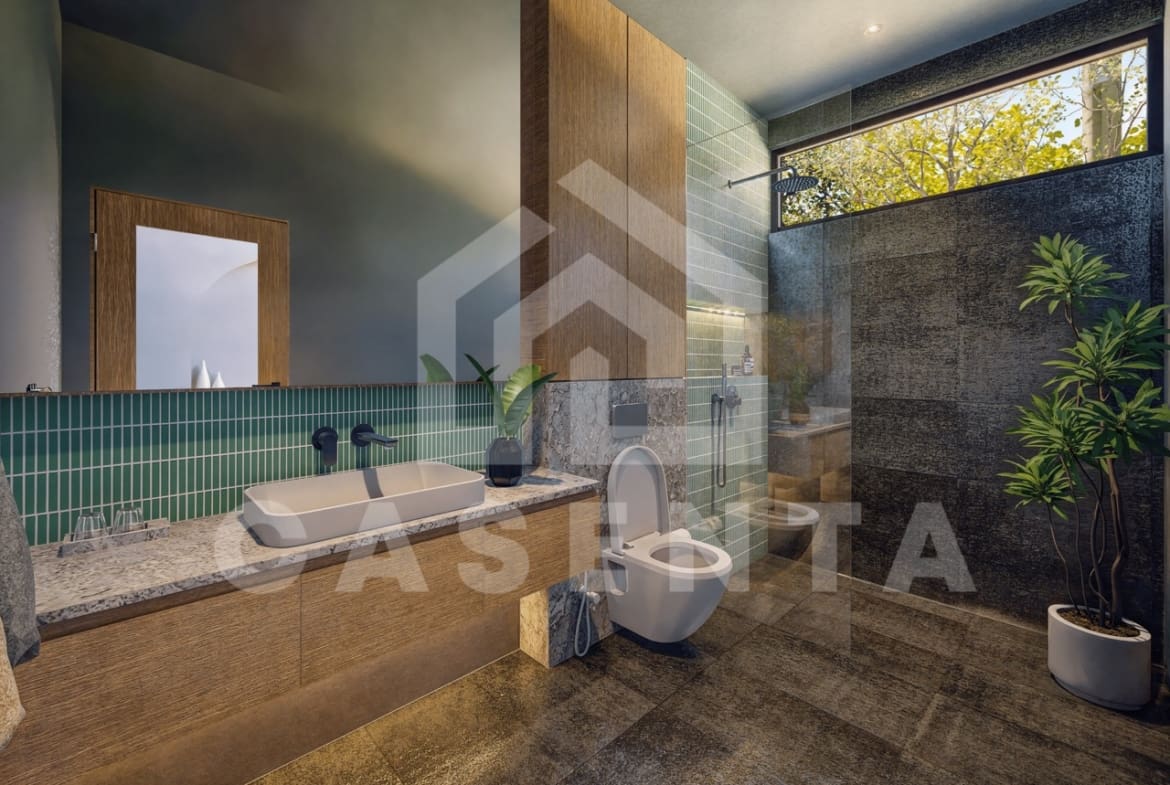 Modern bathroom in Ubud leasehold villa with walk-in shower, green tiles, stone finishes, and natural light