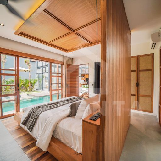 Pool-access bedroom in modern cemagi villa