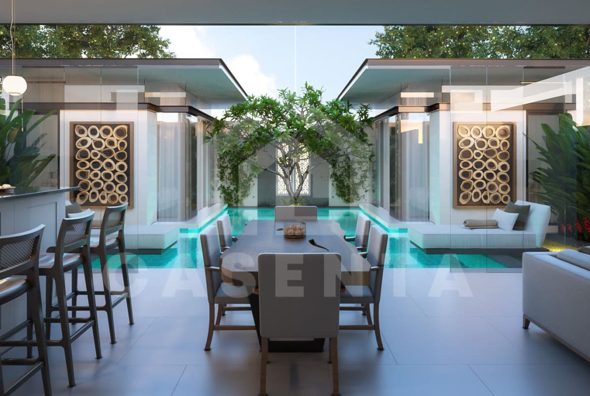 Open dining area overlooking pool in Jimbaran resort villa