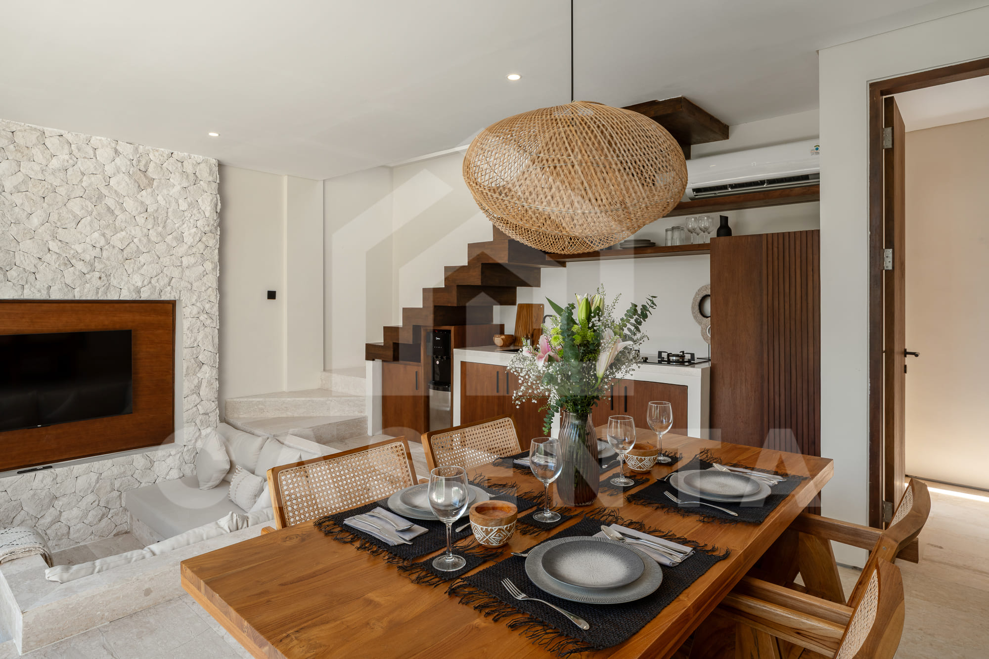 Dining space with wood finishes in Batu Bolong Villa