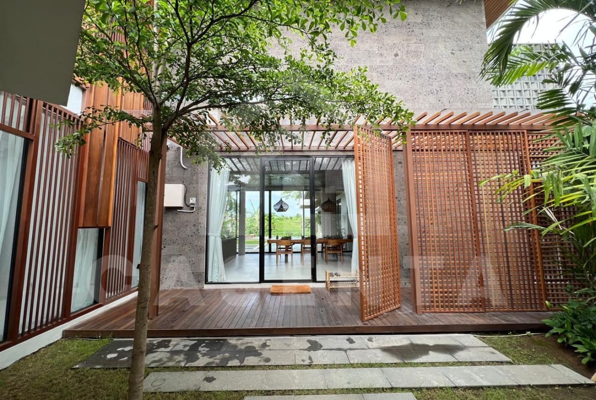 Entrance of luxury Pererenan villa with tropical wood facade