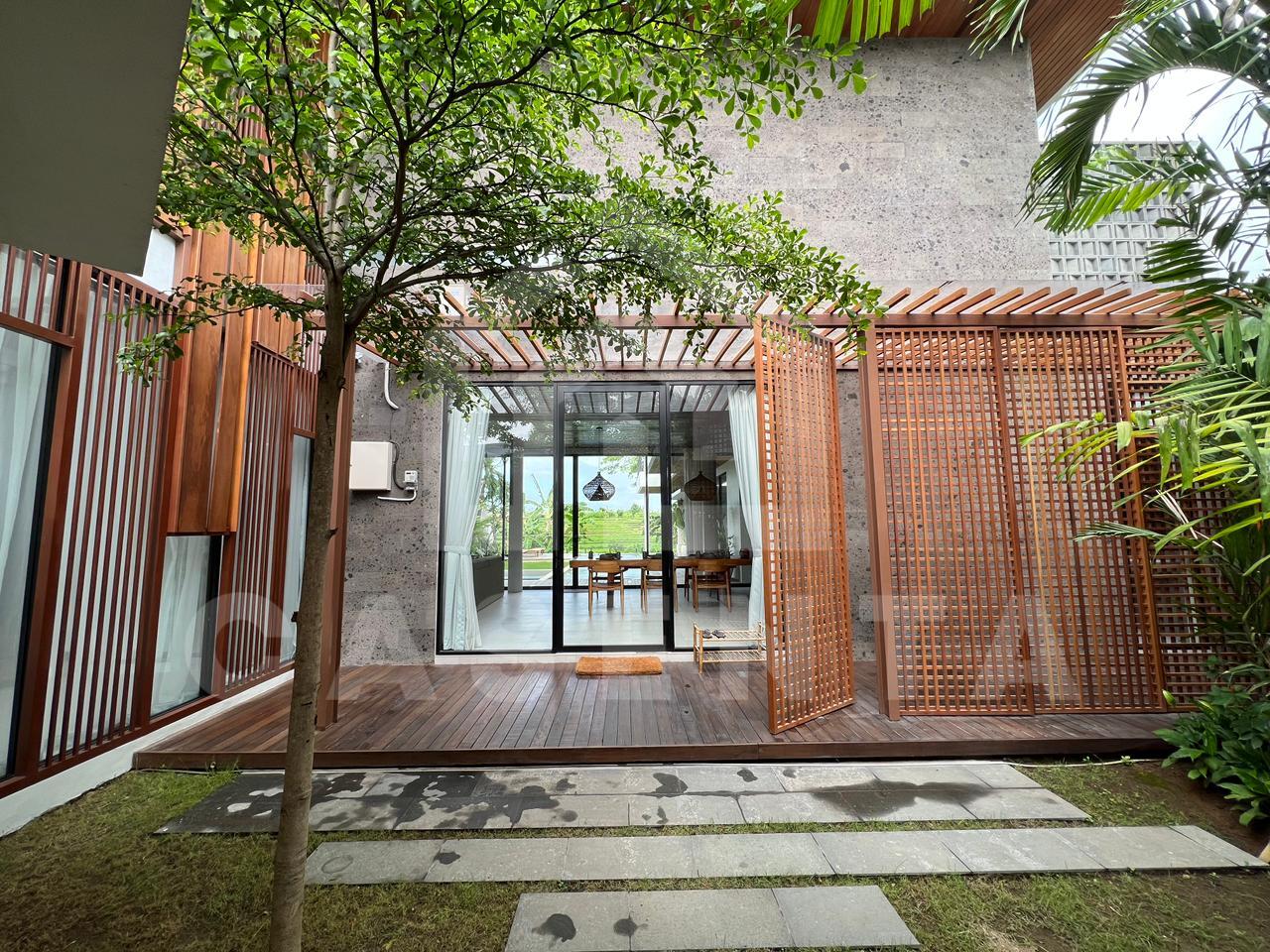 Entrance of luxury Pererenan villa with tropical wood facade
