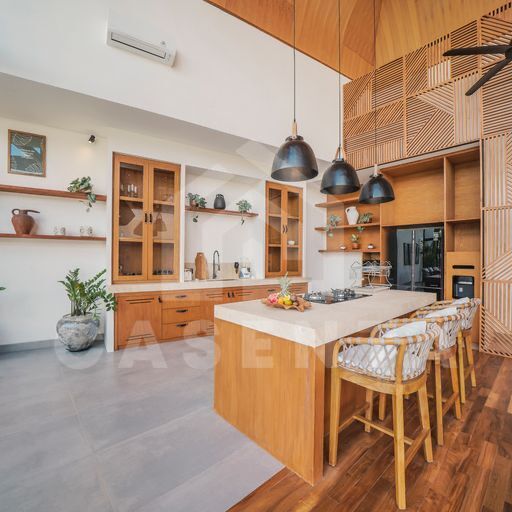Fully equipped kitchen with island in cemagi villa