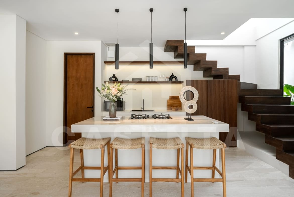 Kitchen island with bar stools in contemporary batu bolong villa