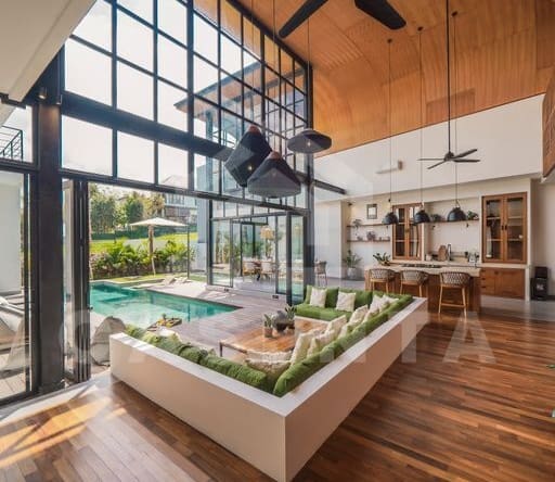 Sunken living area with pool view in cemagi villa
