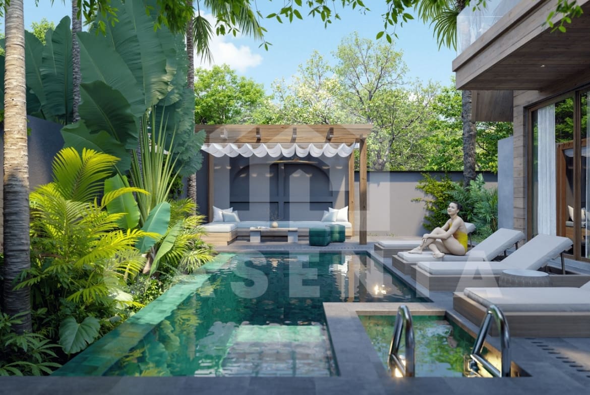 Private swimming pool in Ubud leasehold villa surrounded by tropical plants and sun loungers