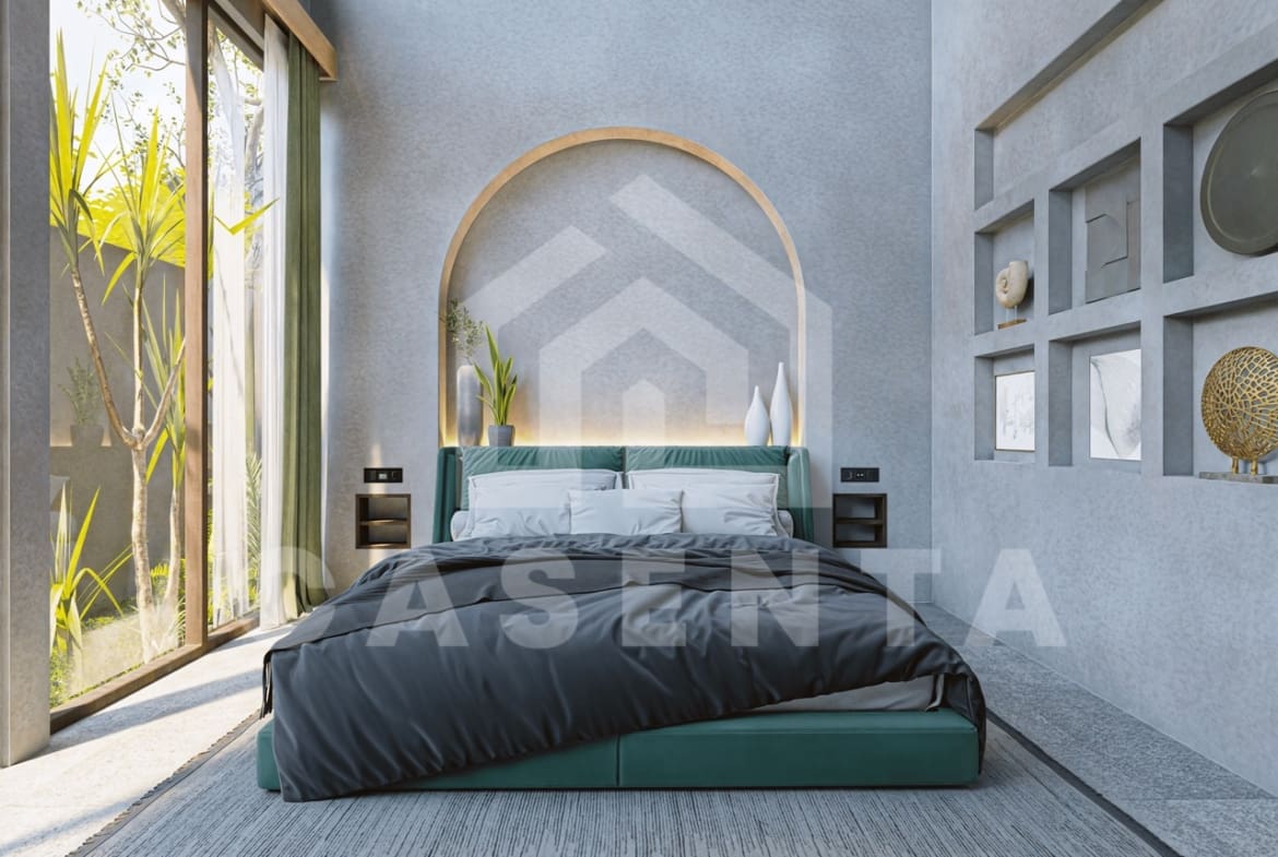 Modern bedroom in Ubud leasehold villa with arched headboard, garden access, and natural light