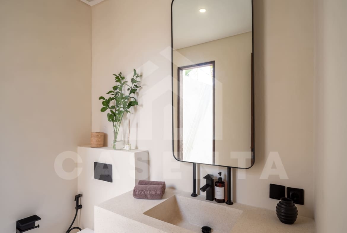Modern bathroom with floating vanity in Batu Bolong Villa