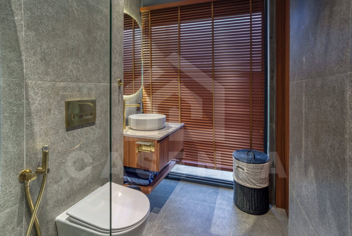 Modern ensuite bathroom in Pandawa villa with stone finishes