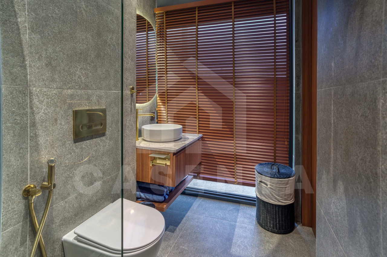 Modern ensuite bathroom in Pandawa villa with stone finishes