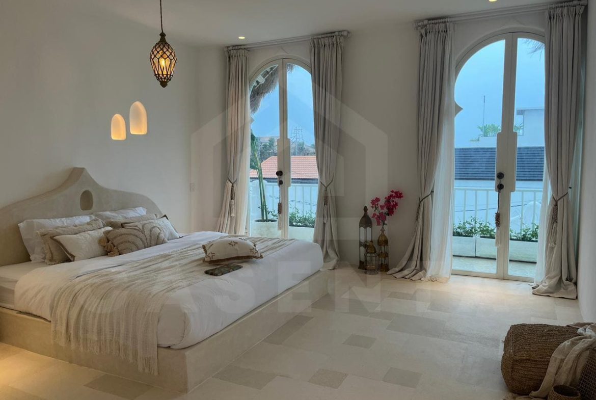Bright bedroom in aesthetic seseh villa with balcony doors and Mediterranean interior design