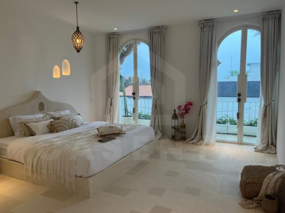 Bright bedroom in aesthetic seseh villa with balcony doors and Mediterranean interior design
