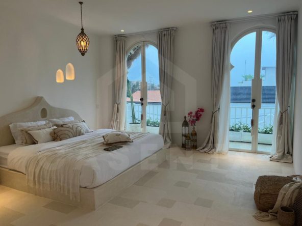 Bright bedroom in aesthetic seseh villa with balcony doors and Mediterranean interior design