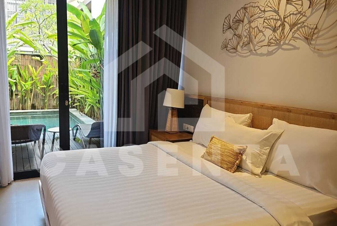 Modern bedroom with pool access in Canggu villa