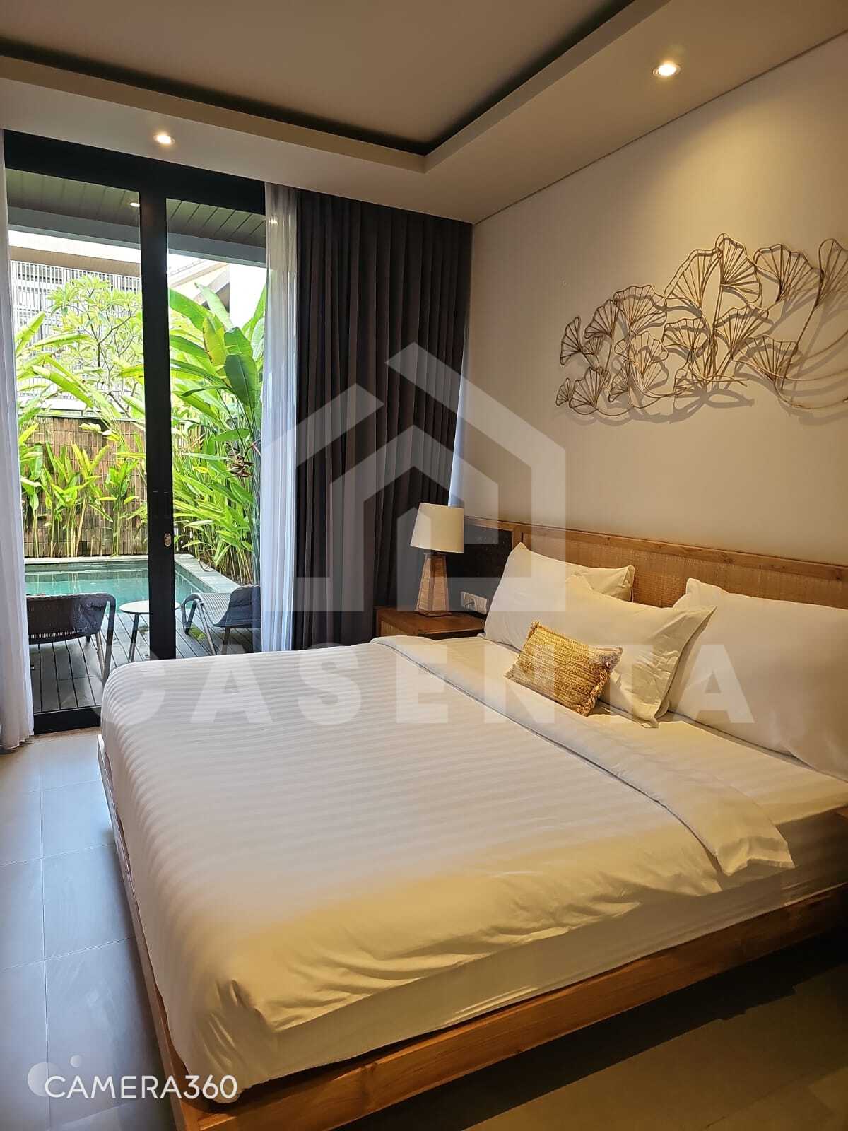 Modern bedroom with pool access in Canggu villa