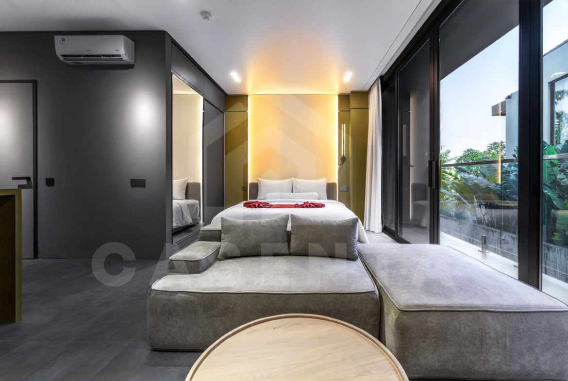 Modern Canggu apartment living and bedroom with natural light and glass doors