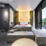 Modern Canggu apartment living and bedroom with natural light and glass doors
