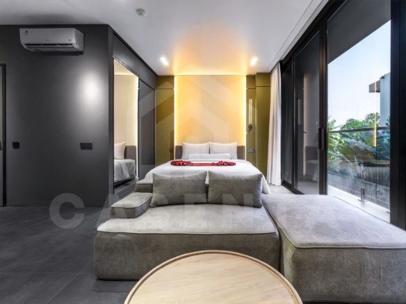 Modern Canggu apartment living and bedroom with natural light and glass doors