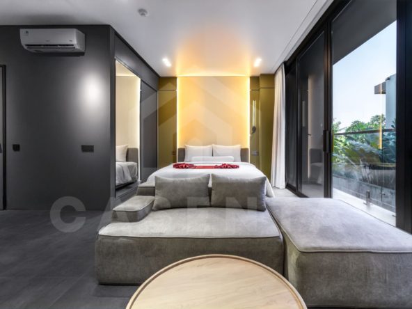 Modern Canggu apartment living and bedroom with natural light and glass doors
