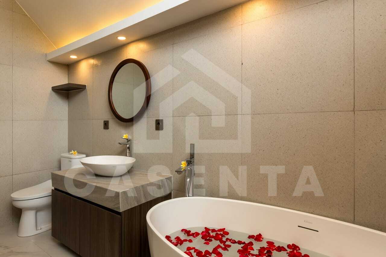 Modern villa bathroom with freestanding bathtub in saba beach villa Gianyar