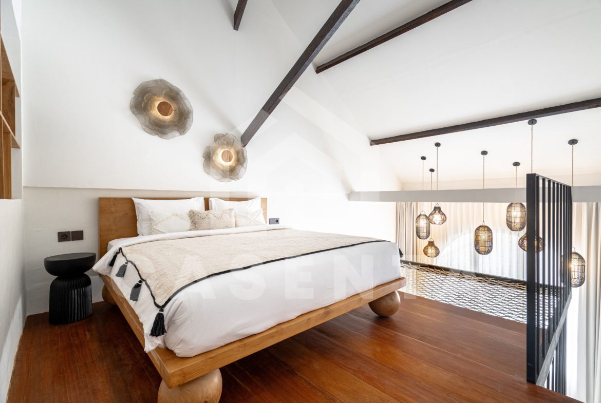 Loft bedroom with mezzanine layout in Sanur apartment
