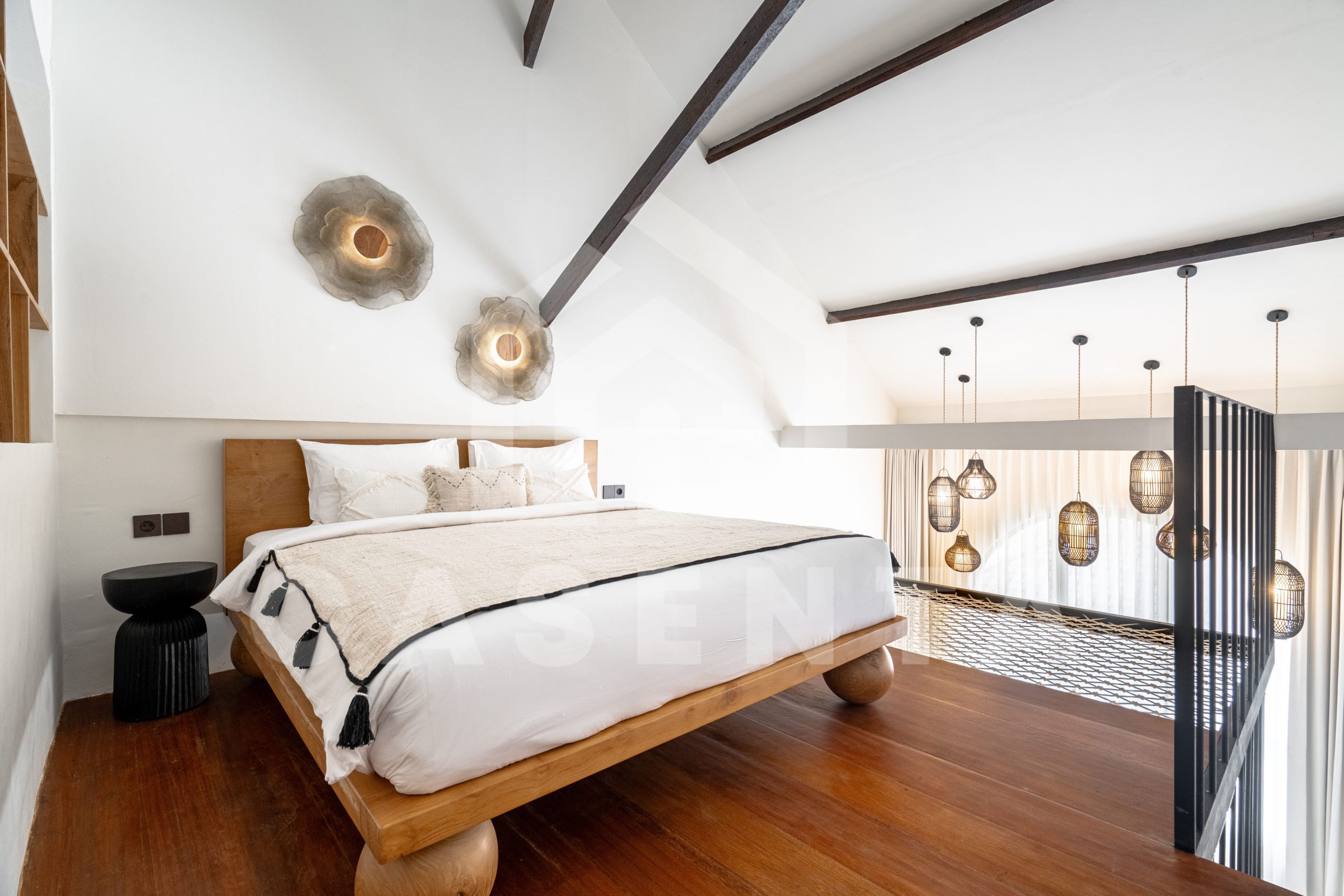 Loft bedroom with mezzanine layout in Sanur apartment