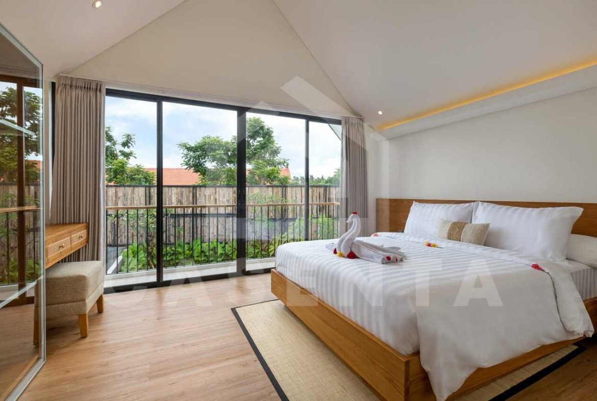 Bright bedroom with balcony in modern saba beach villa