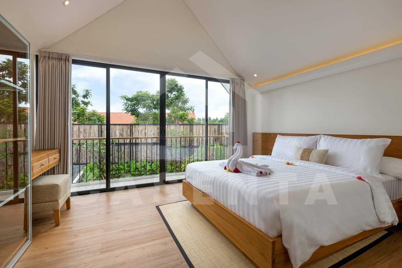 Bright bedroom with balcony in modern saba beach villa