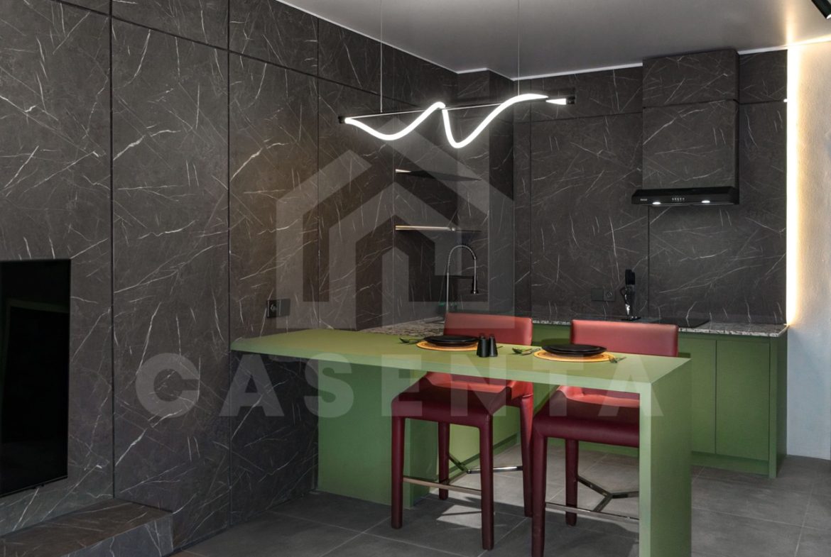 Dining and kitchen area in modern Canggu apartment with open layout