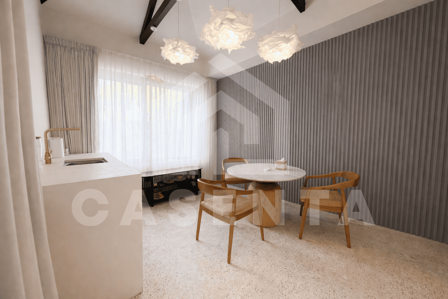 Dining area with marble table in compact Sanur villa