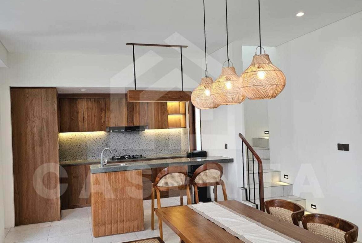 Open dining and kitchen area in modern cemagi villa