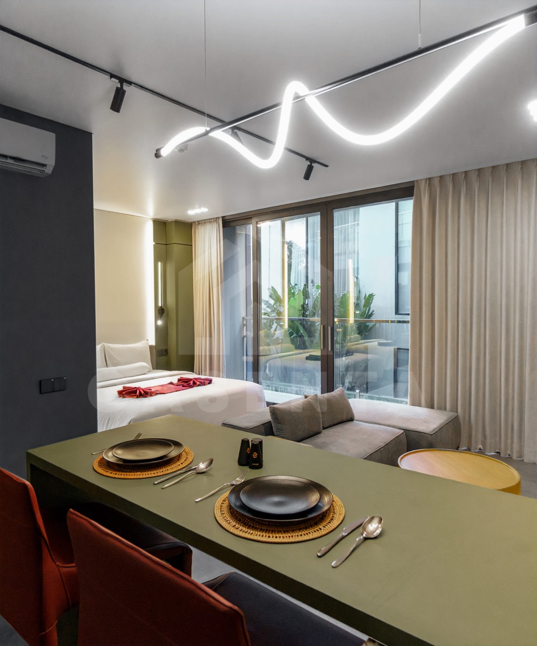 Compact dining setup in Canggu apartment with modern furniture