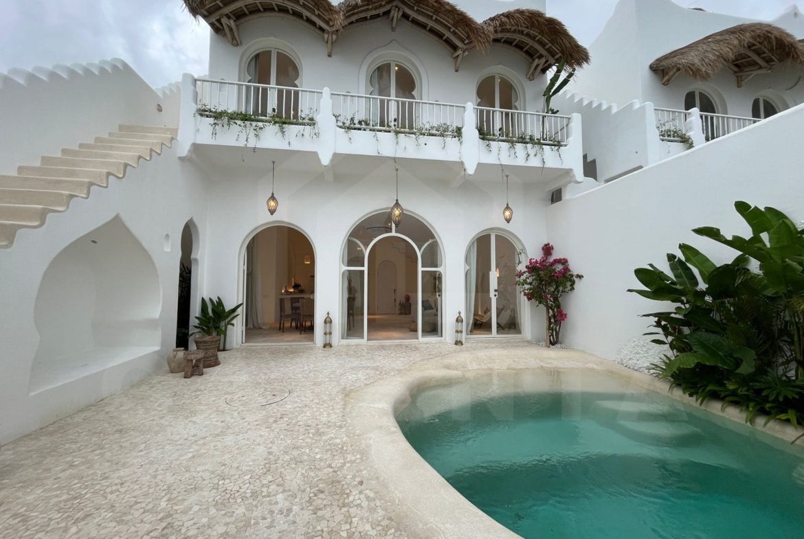 Exterior facade of aesthetic Mediterranean seseh villa with private pool