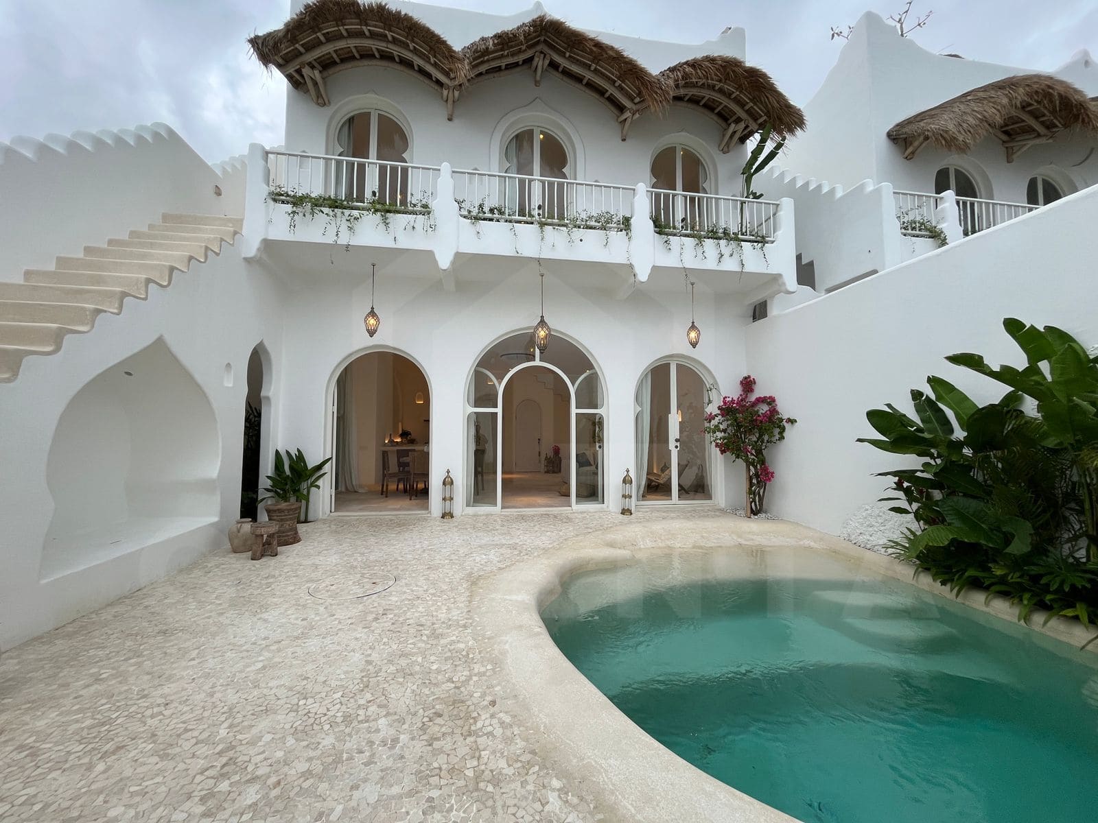 Exterior facade of aesthetic Mediterranean seseh villa with private pool