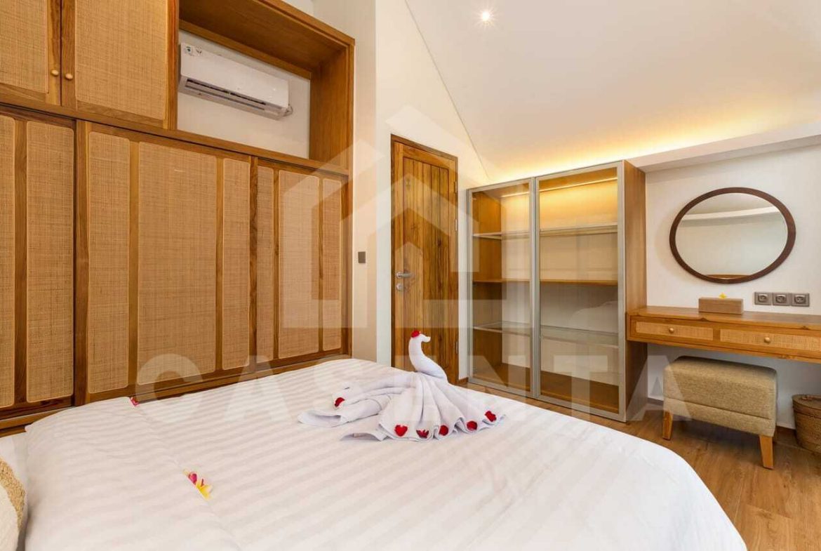 Modern bedroom with built-in wardrobes in Bali villa near Saba Beach