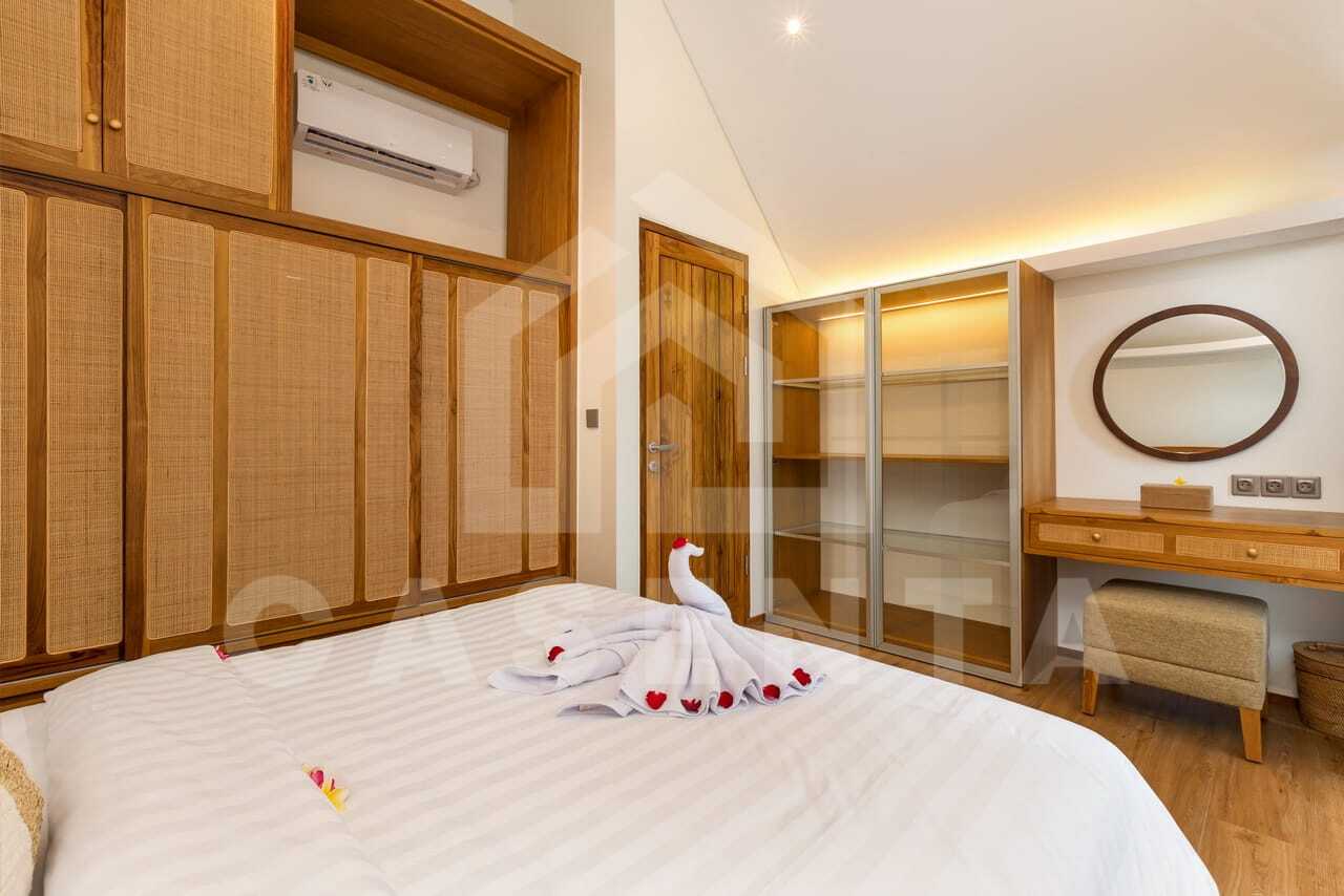 Modern bedroom with built-in wardrobes in Bali villa near Saba Beach