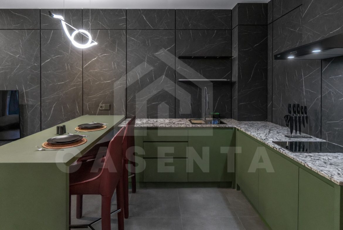 Fully equipped kitchen in Canggu apartment with modern finishes