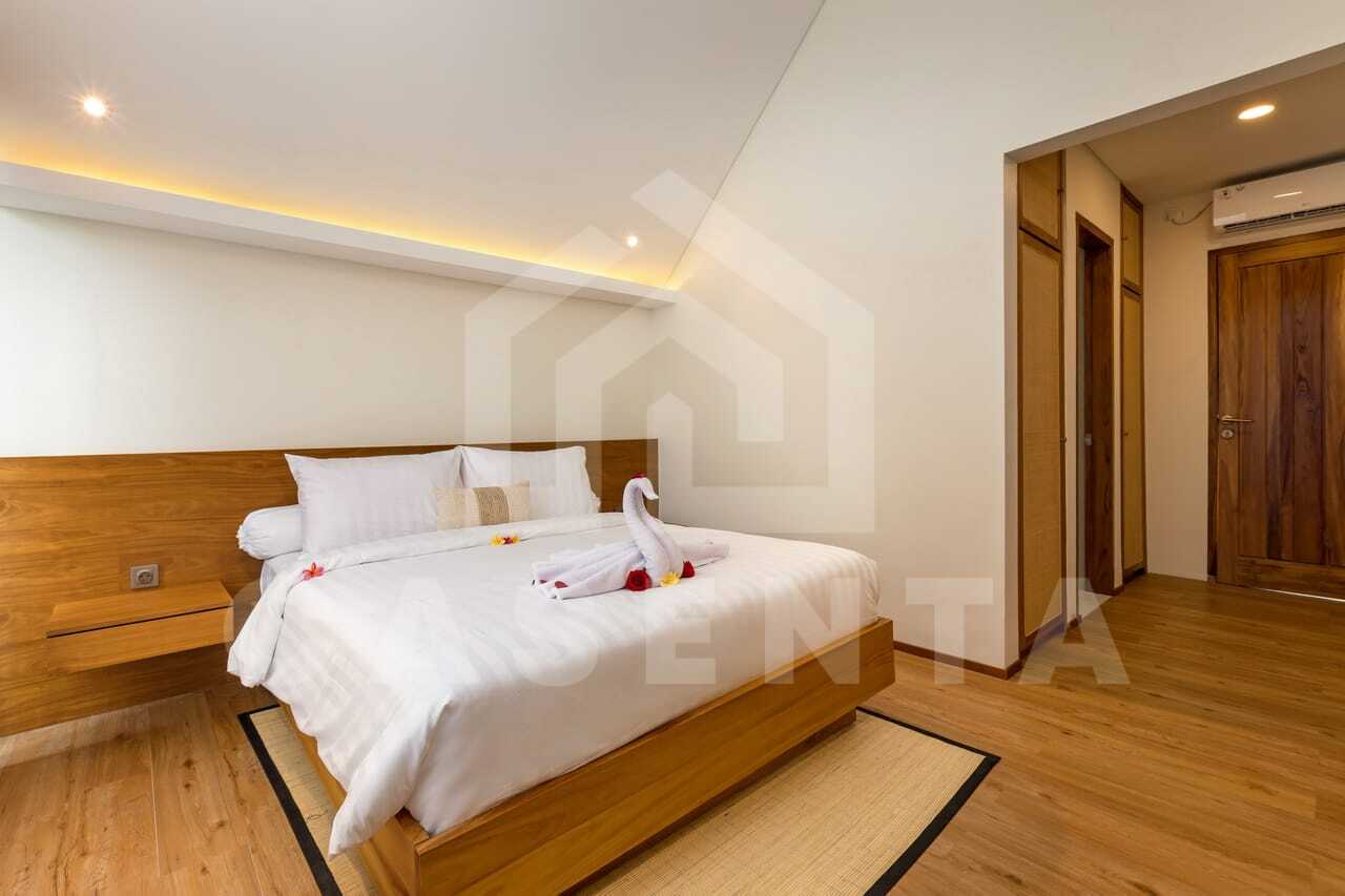 Spacious minimalist bedroom inside saba beach villa