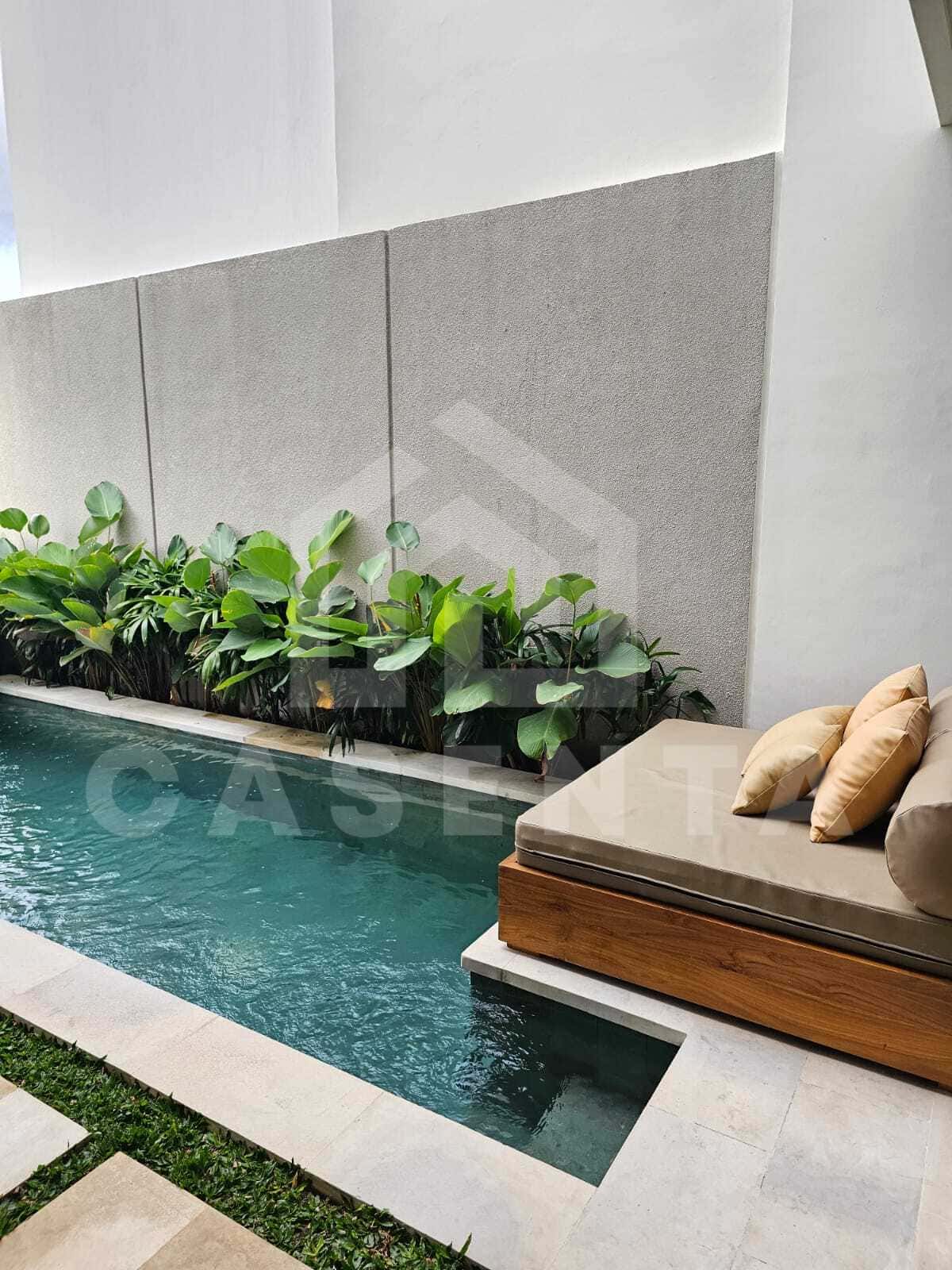 Private pool with lounge area at cemagi villa