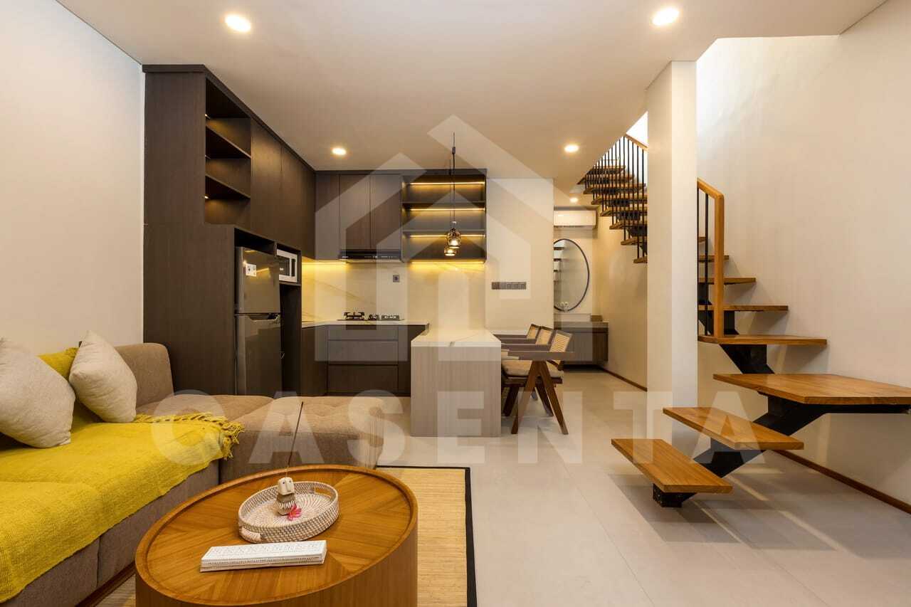 Open living and dining area with kitchen island in saba beach villa