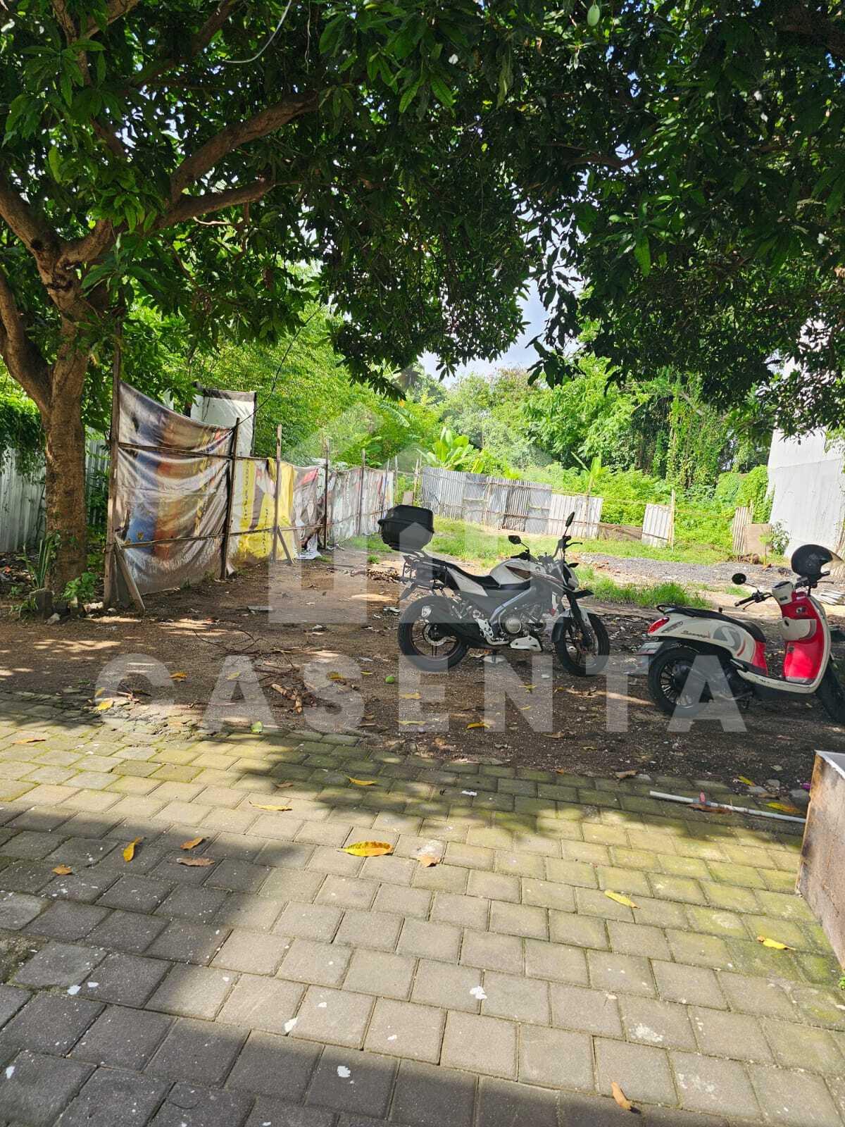 Commercial Sanur land with paved access and nearby residential buildings