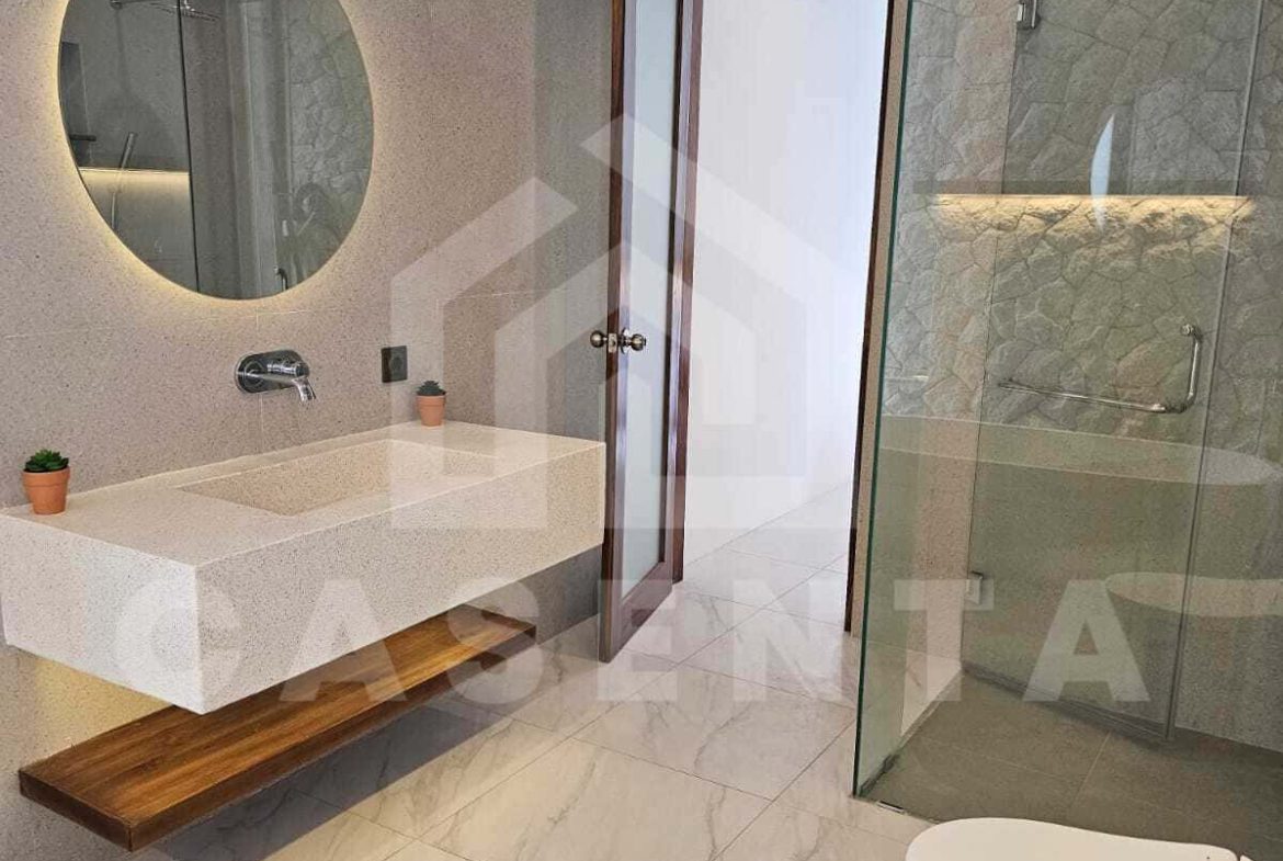 Modern bathroom with rain shower in cemagi villa