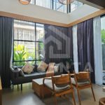 High ceiling living area in Canggu villa with large windows