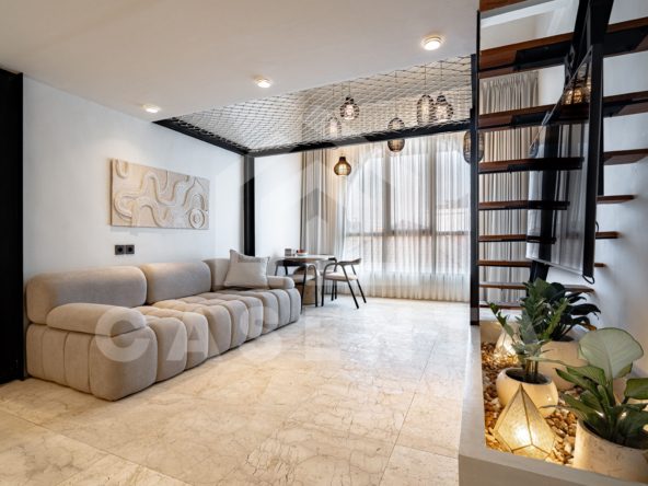 Open living space with mezzanine loft in Sanur apartment