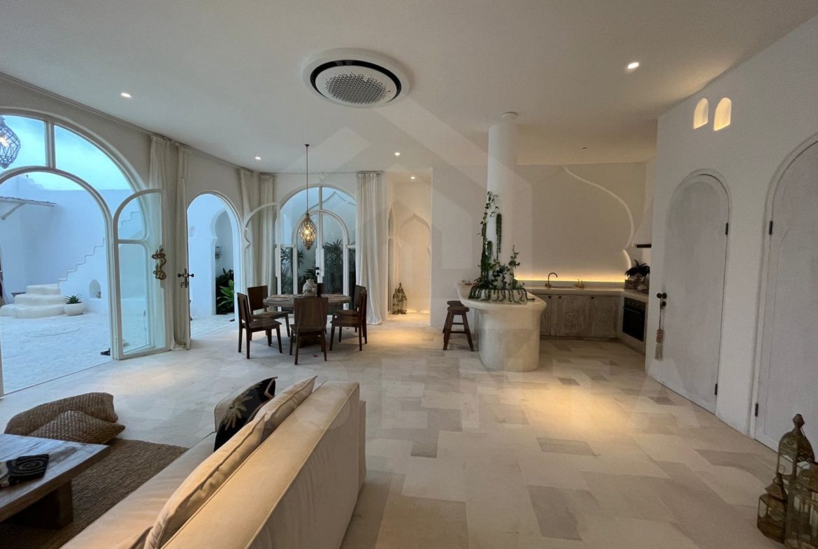 Open living and dining layout in Mediterranean seseh villa