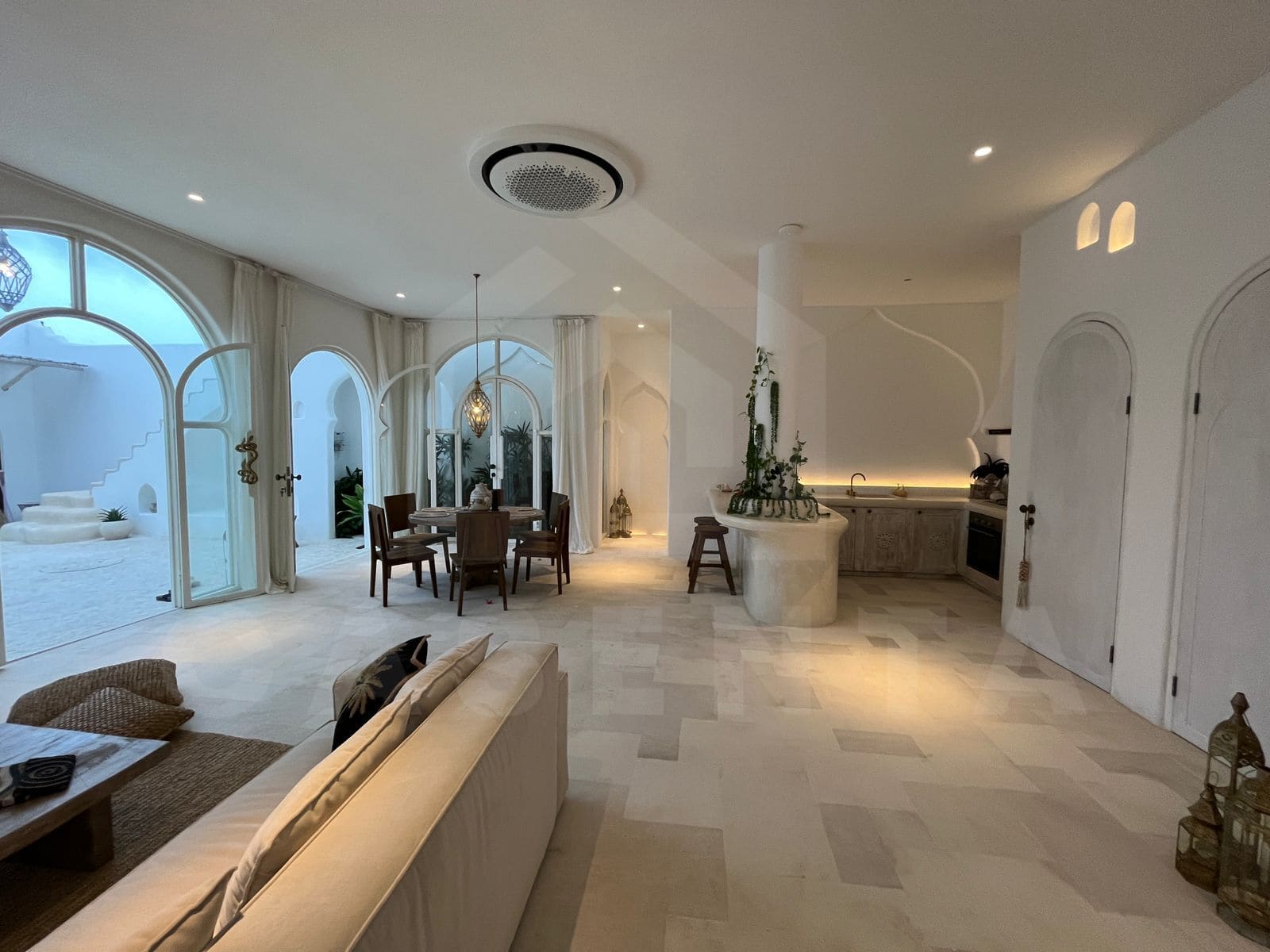 Open living and dining layout in Mediterranean seseh villa