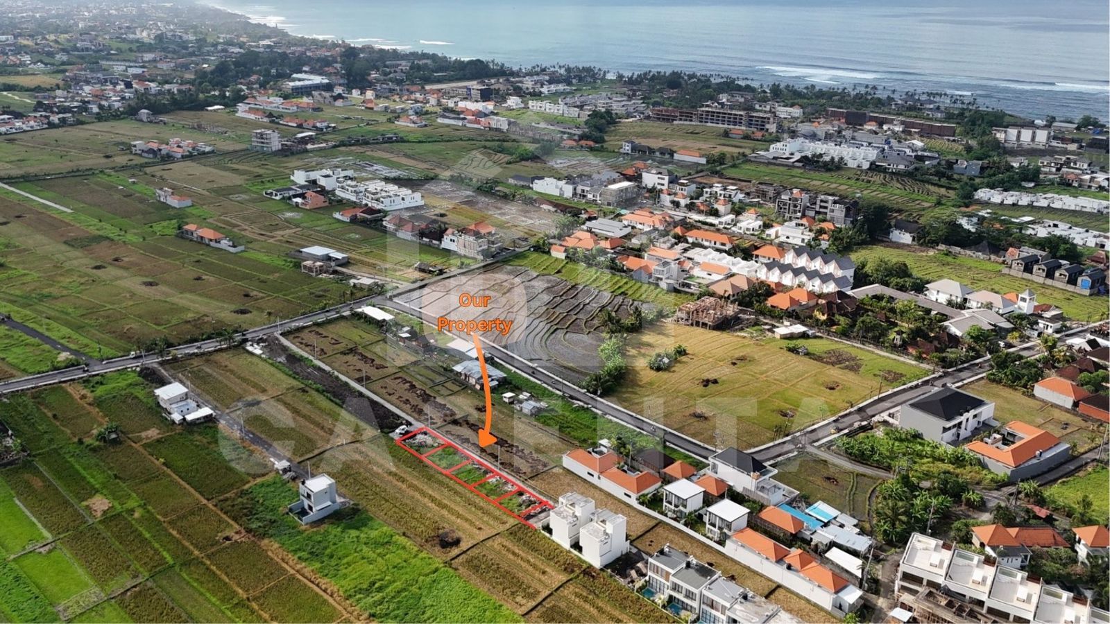 subdivided Cemagi land plots near the beach with surrounding villas and rice fields