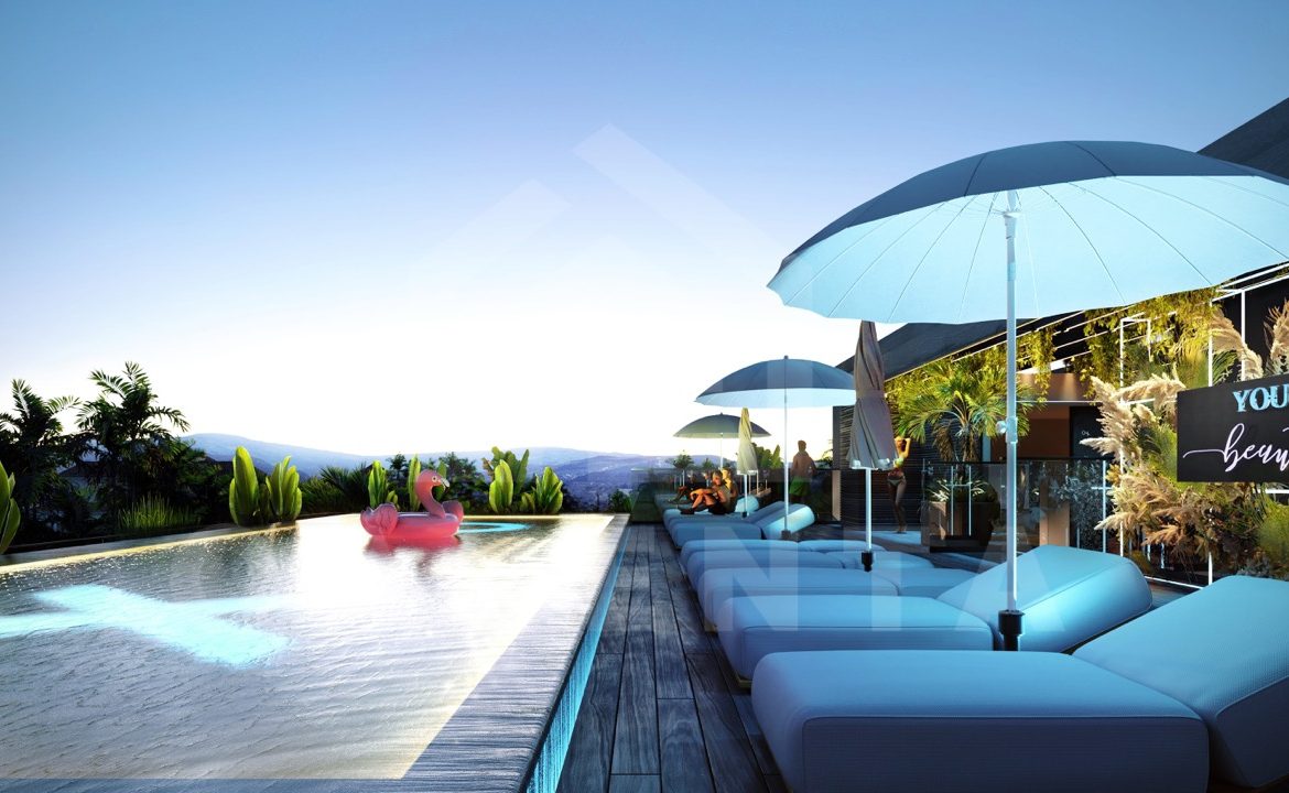 Infinity pool with ocean view at Canggu apartment complex