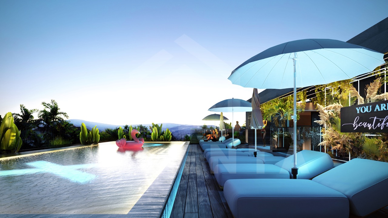 Infinity pool with ocean view at Canggu apartment complex