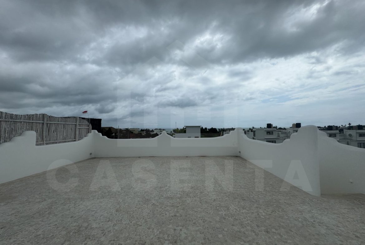 Rooftop terrace with rice field and ocean views at seseh villa